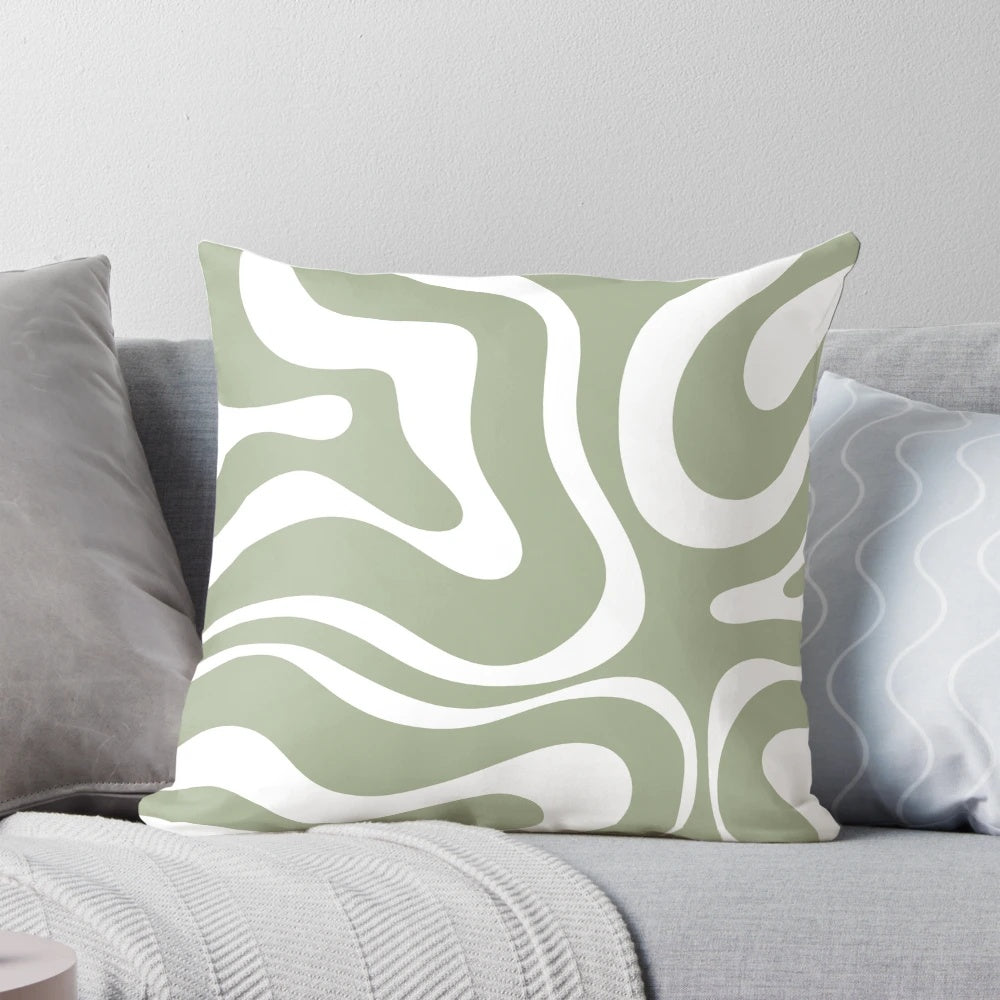 Liquid swirl abstract pattern in sage green and white on a plush pillow
