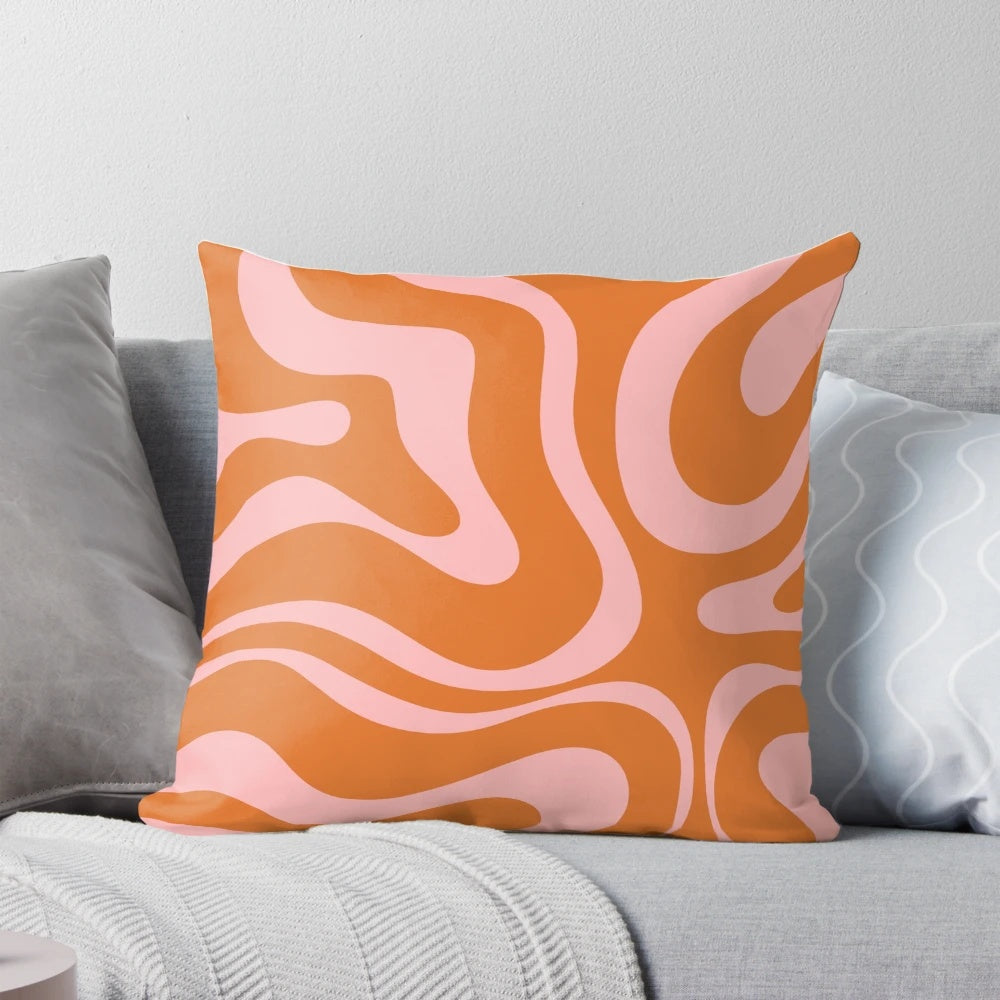 Colorful abstract pattern pillow with a retro liquid swirl design in orange and pink.