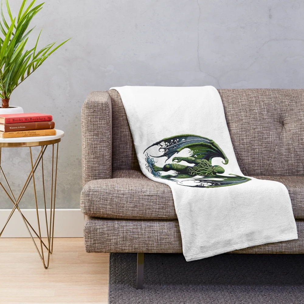 Cthulhu plush blanket with embroidered fantasy creature design