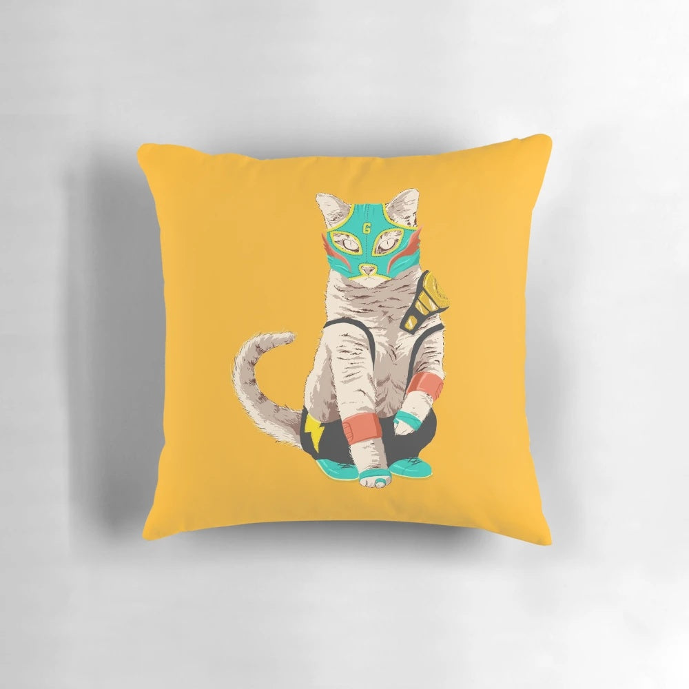 A plush, colorful pillow featuring a luchador-style cat, perfect for adding a playful touch to any living space.