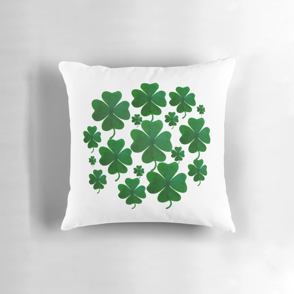 A hand-painted, 4-leaf shamrock pillow with a charming, balanced pattern