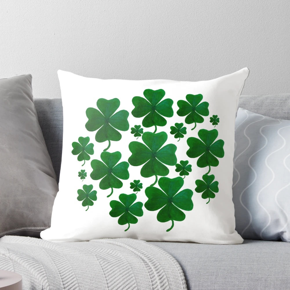 A hand-painted, 4-leaf shamrock pillow with a charming, balanced pattern