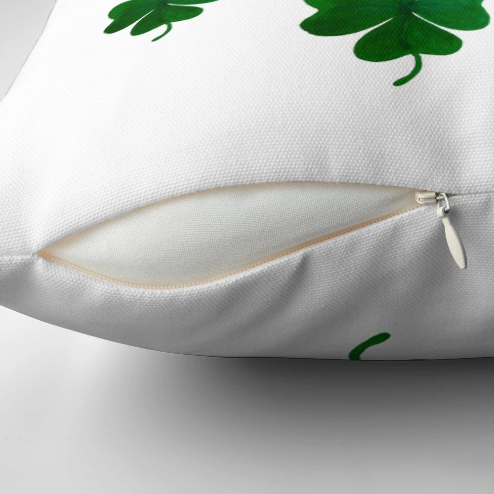 A hand-painted, 4-leaf shamrock pillow with a charming, balanced pattern