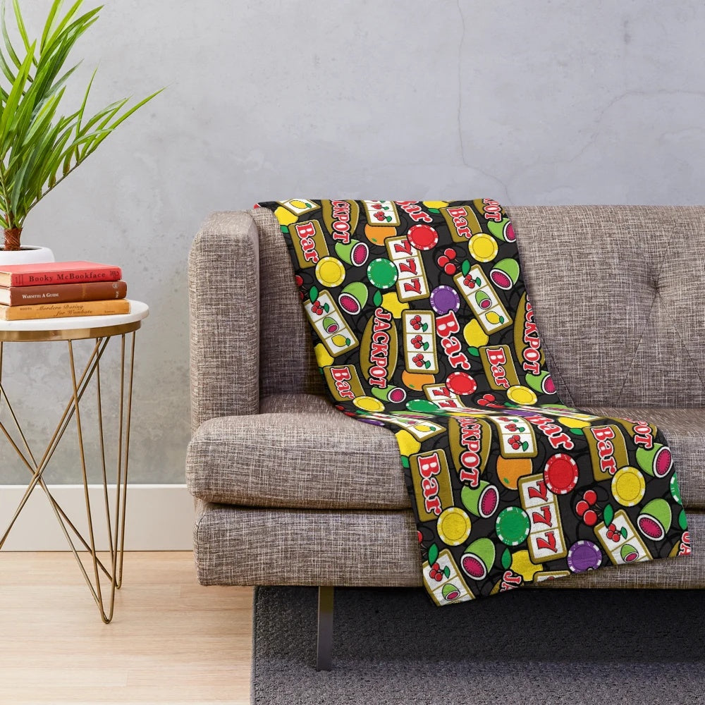Plush blanket with casino-themed slot machine and fruit symbols design