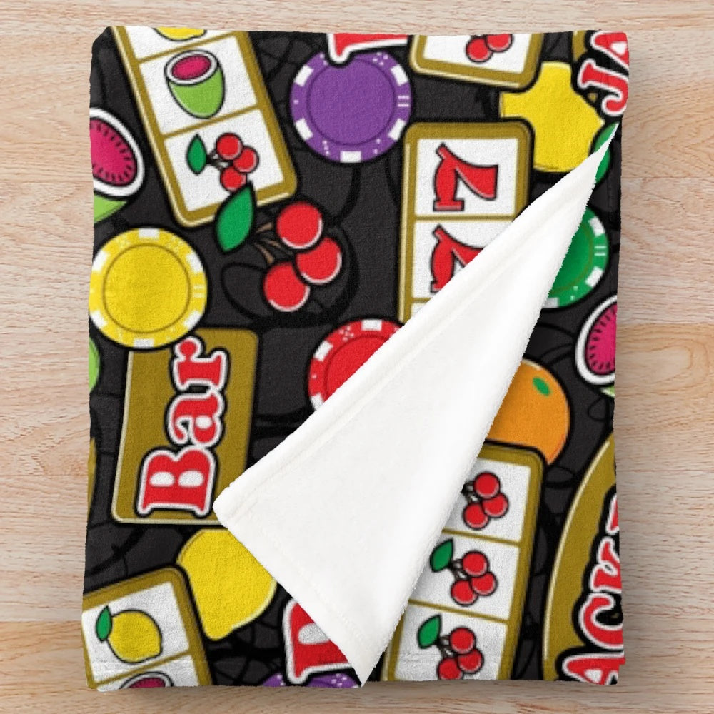 Plush blanket with casino-themed slot machine and fruit symbols design