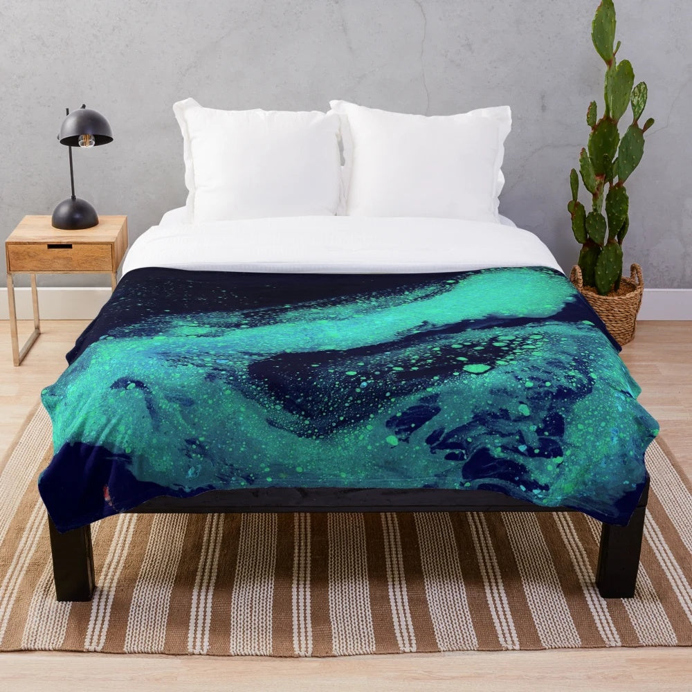 Glow in the dark plush blanket with a cosmic galaxy print design