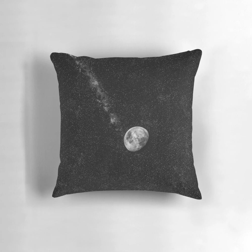 Glowing moon pillow with starry night sky background
