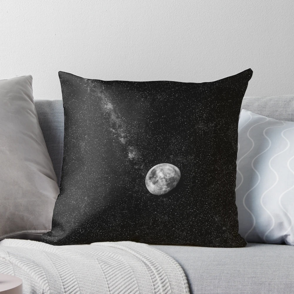 Glowing moon pillow with starry night sky background