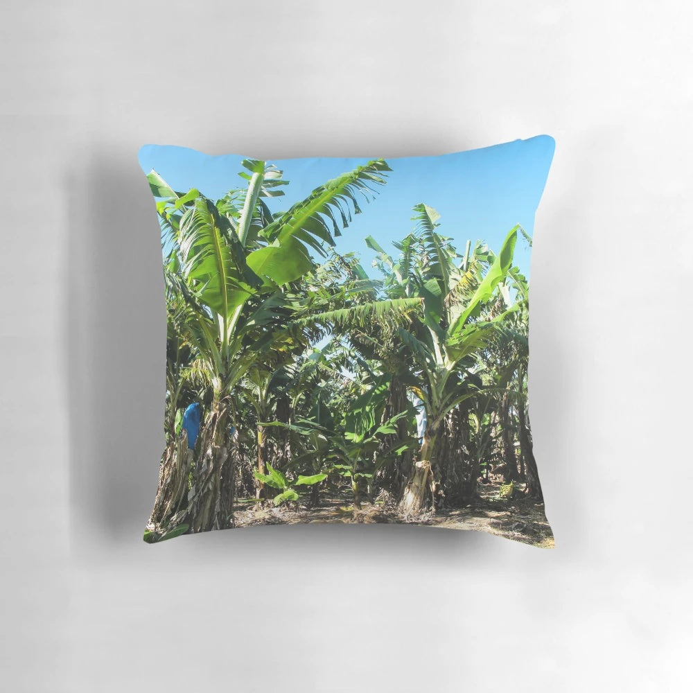 Vibrant green banana plants pillow, perfect for adding a touch of tropical flair to your living space.