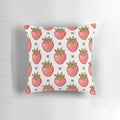 Vibrant strawberry-patterned pillow with lush leaves and pastel accents