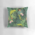 Decorative pillow featuring a vibrant tropical leaves and jungle creatures pattern in shades of green, pink, and white.