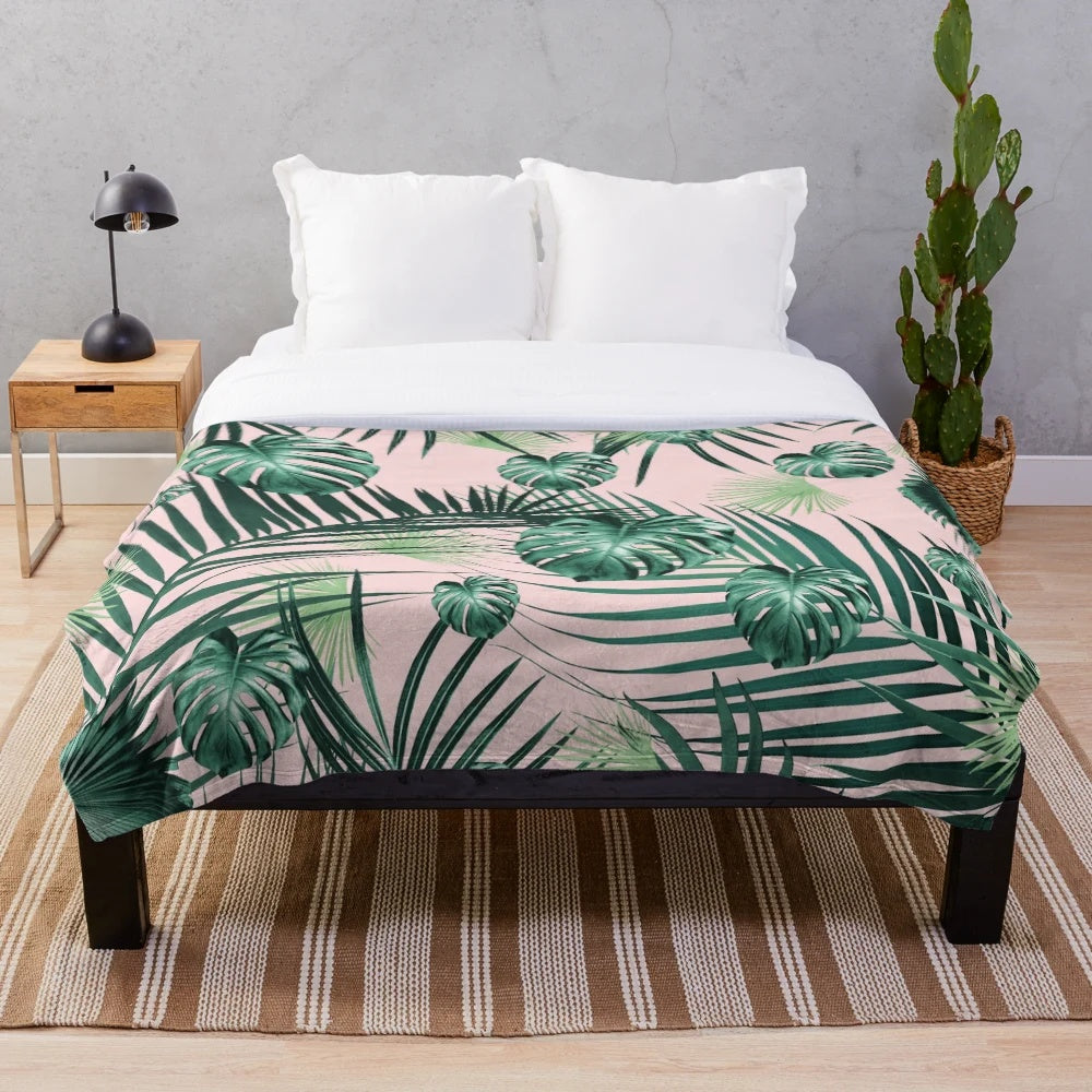Tropical leaves plush blanket featuring a collage of exotic foliage and botanicals