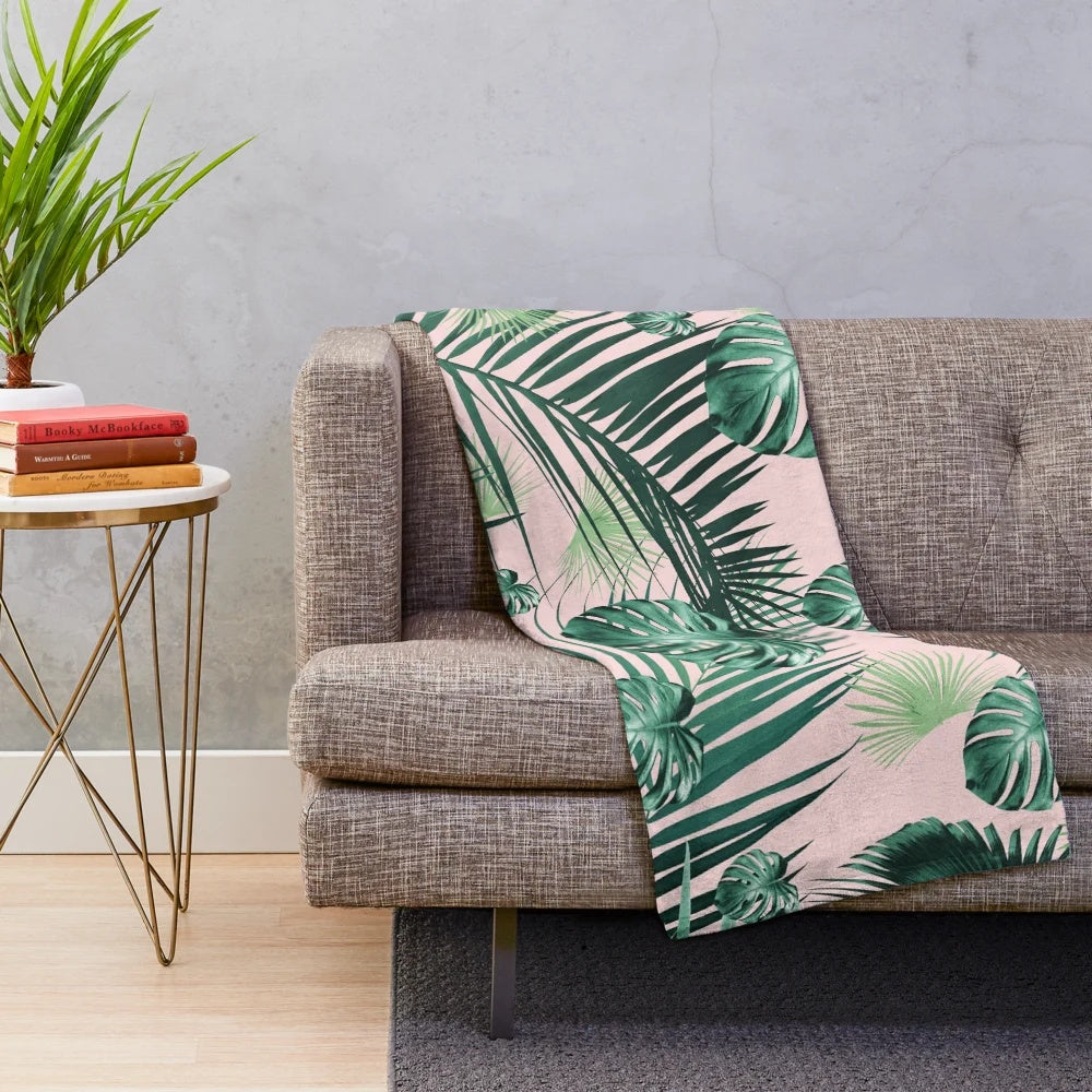 Tropical leaves plush blanket featuring a collage of exotic foliage and botanicals