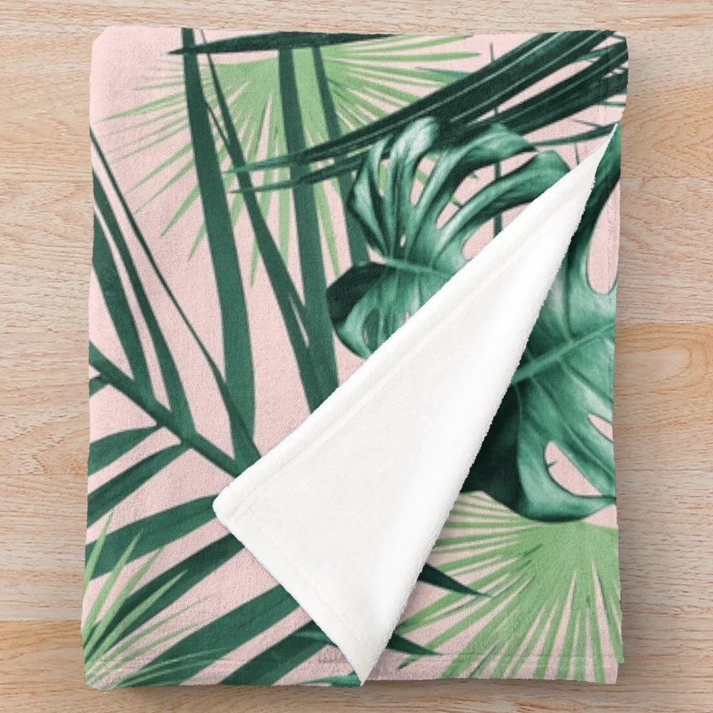 Tropical leaves plush blanket featuring a collage of exotic foliage and botanicals