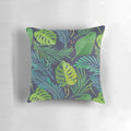 Tropical rainforest-inspired pillow featuring a vibrant botanical pattern with palm trees and banana leaves.