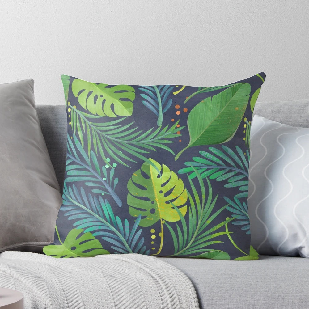 Tropical rainforest-inspired pillow featuring a vibrant botanical pattern with palm trees and banana leaves.
