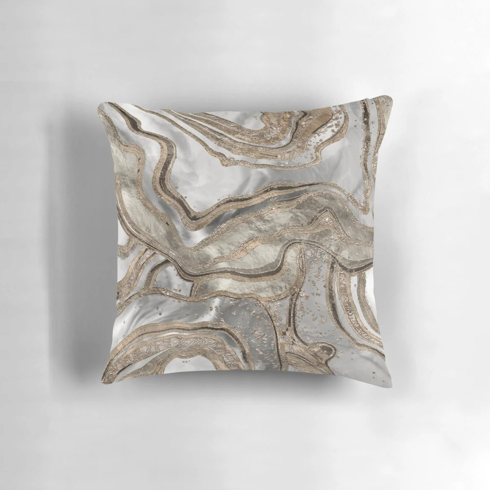 Luxurious abstract marble-patterned pillow in shades of pearl and gold