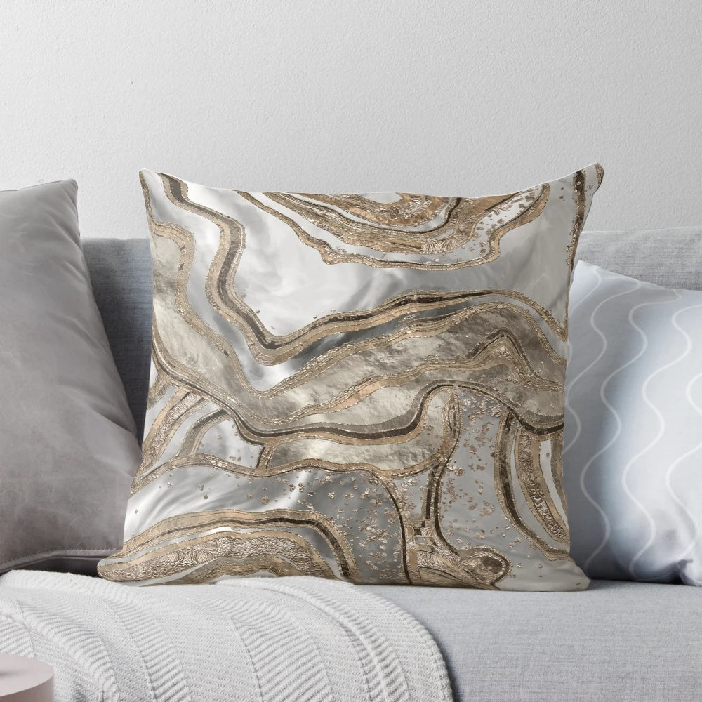 Luxurious abstract marble-patterned pillow in shades of pearl and gold