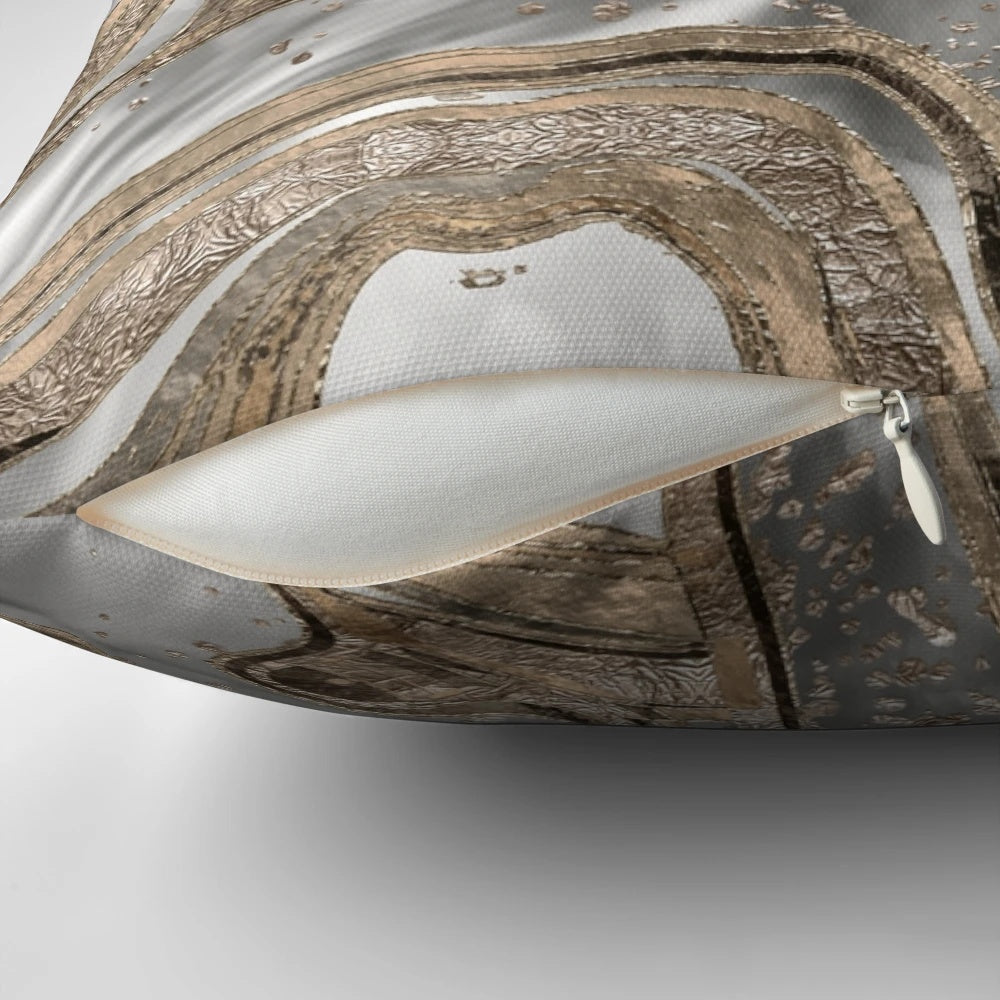 Luxurious abstract marble-patterned pillow in shades of pearl and gold