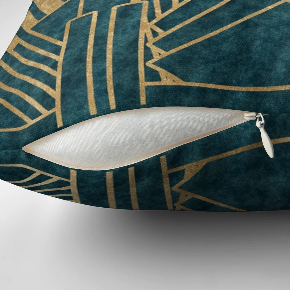 Teal and gold art deco inspired decorative pillow with geometric patterns and a luxurious texture.
