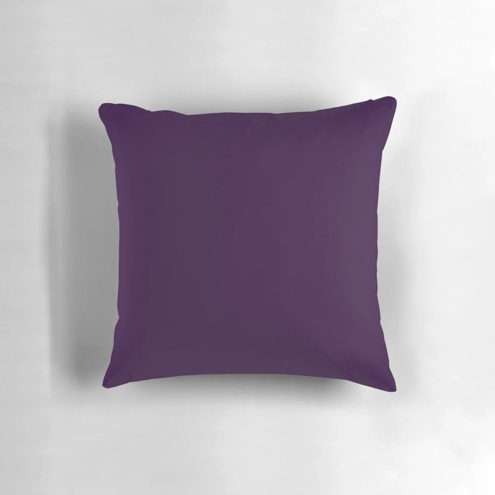 Richly-hued aubergine or dark purple pillow with a minimalist design, perfect for adding a touch of elegance to any space.