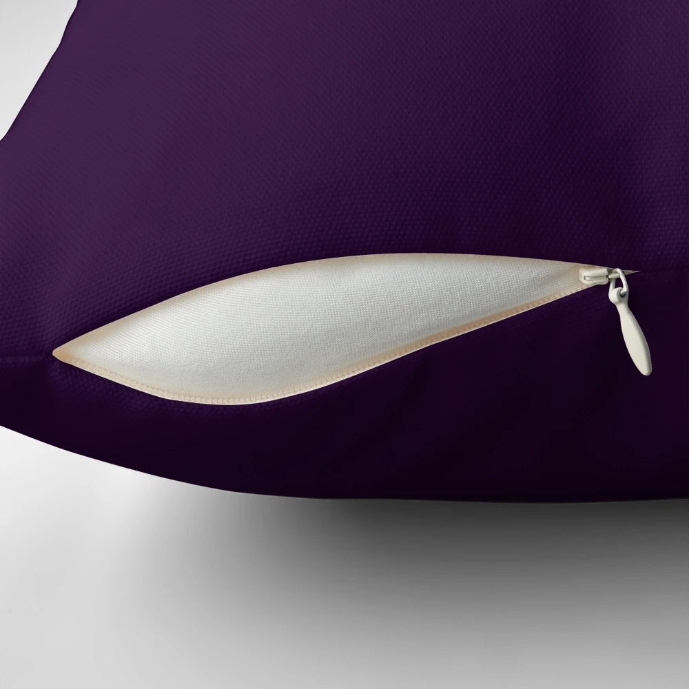 Richly-hued aubergine or dark purple pillow with a minimalist design, perfect for adding a touch of elegance to any space.