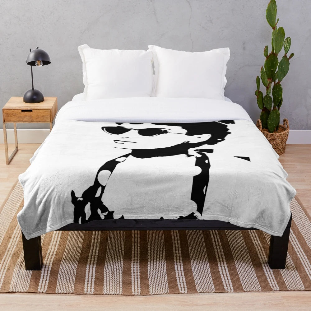 Soft, cozy plush blanket featuring iconic image of Audrey Hepburn
