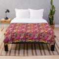 Soft and plush autumn-inspired blanket with jewel tones and nature motifs