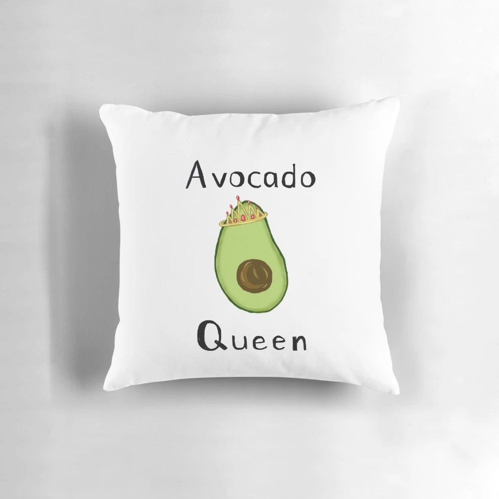 Plush avocado-shaped pillow with a regal crown design
