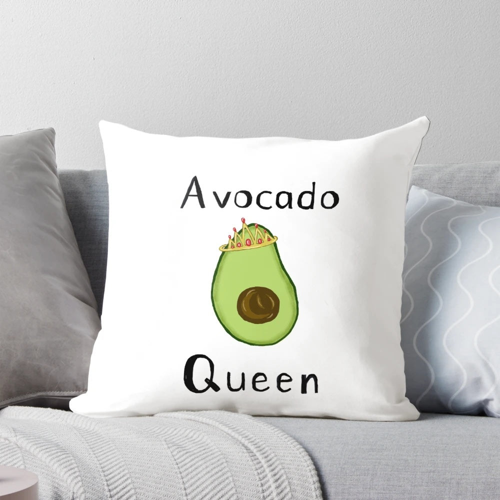 Plush avocado-shaped pillow with a regal crown design