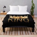 Plush black and gold crown blanket