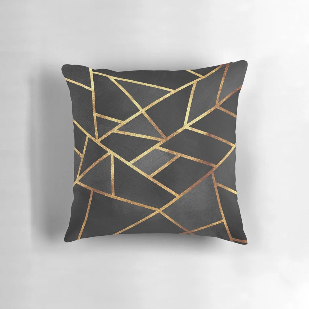 Black and gold geometric pillow with abstract marble pattern design