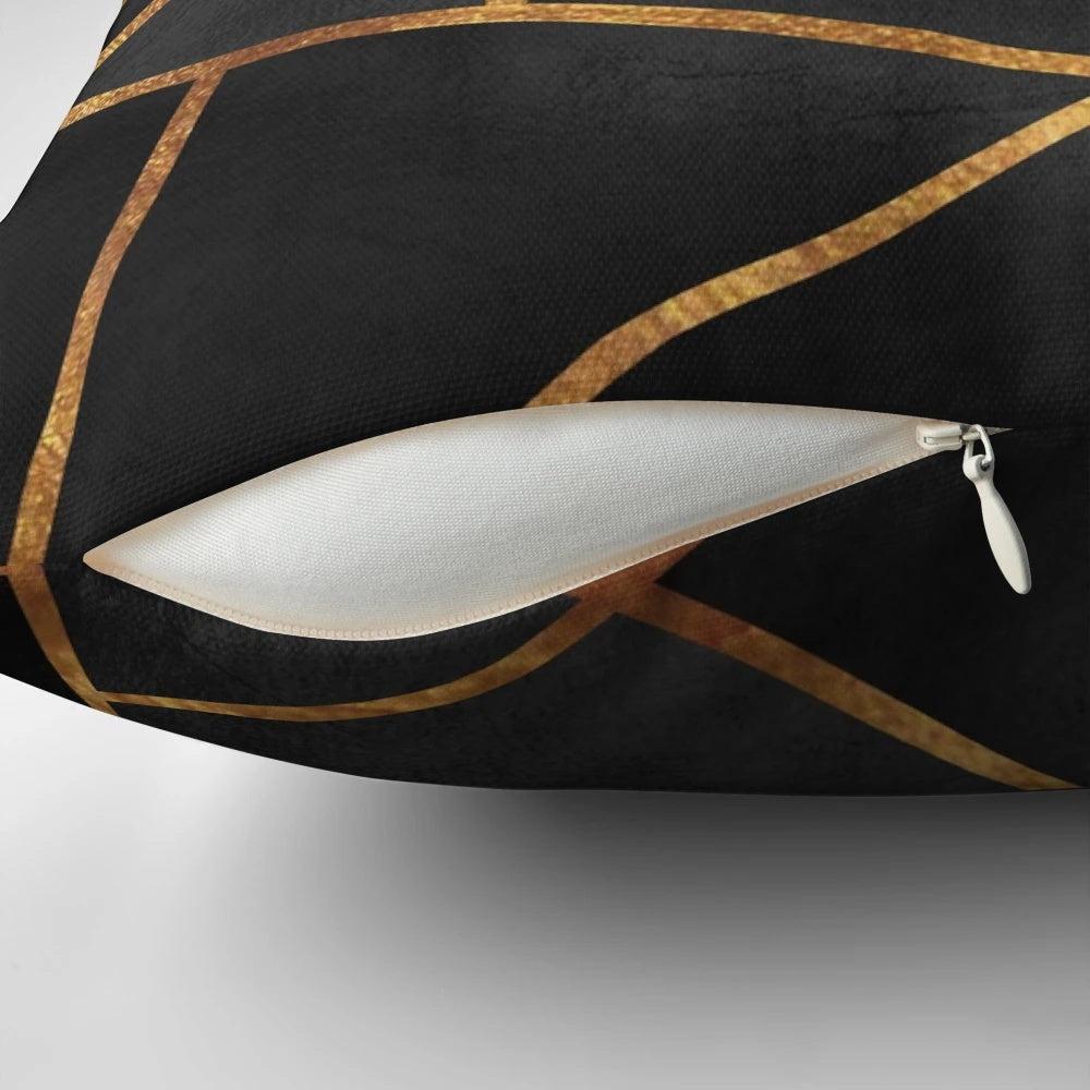 Black and gold geometric pillow with abstract marble pattern design