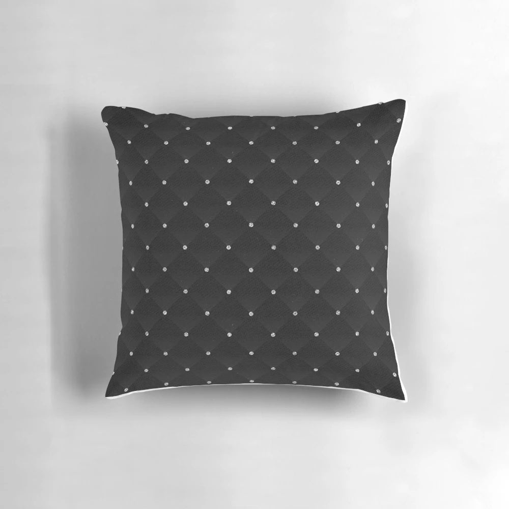 Photorealistic image of a high-quality black velvet quilted pillow with a diamond pattern design.