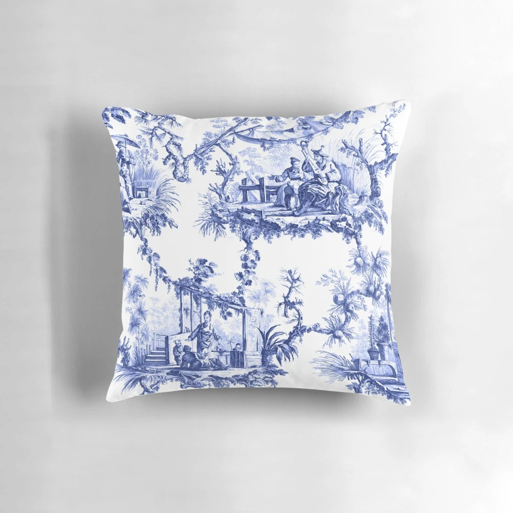 Blue and white chinoiserie toile print pillow with birds and floral pattern