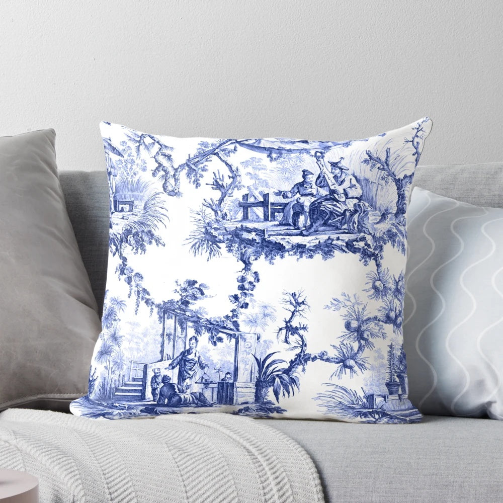 Blue and white chinoiserie toile print pillow with birds and floral pattern