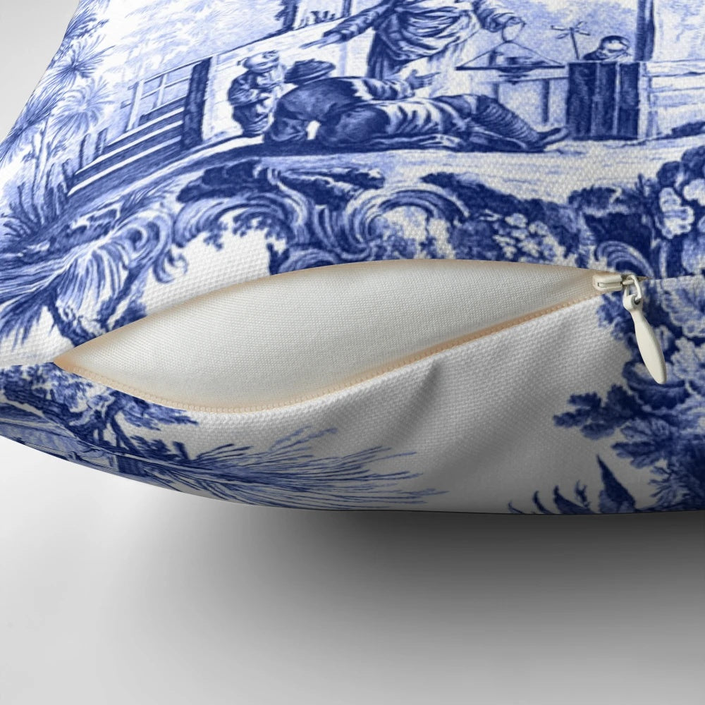 Blue and white chinoiserie toile print pillow with birds and floral pattern
