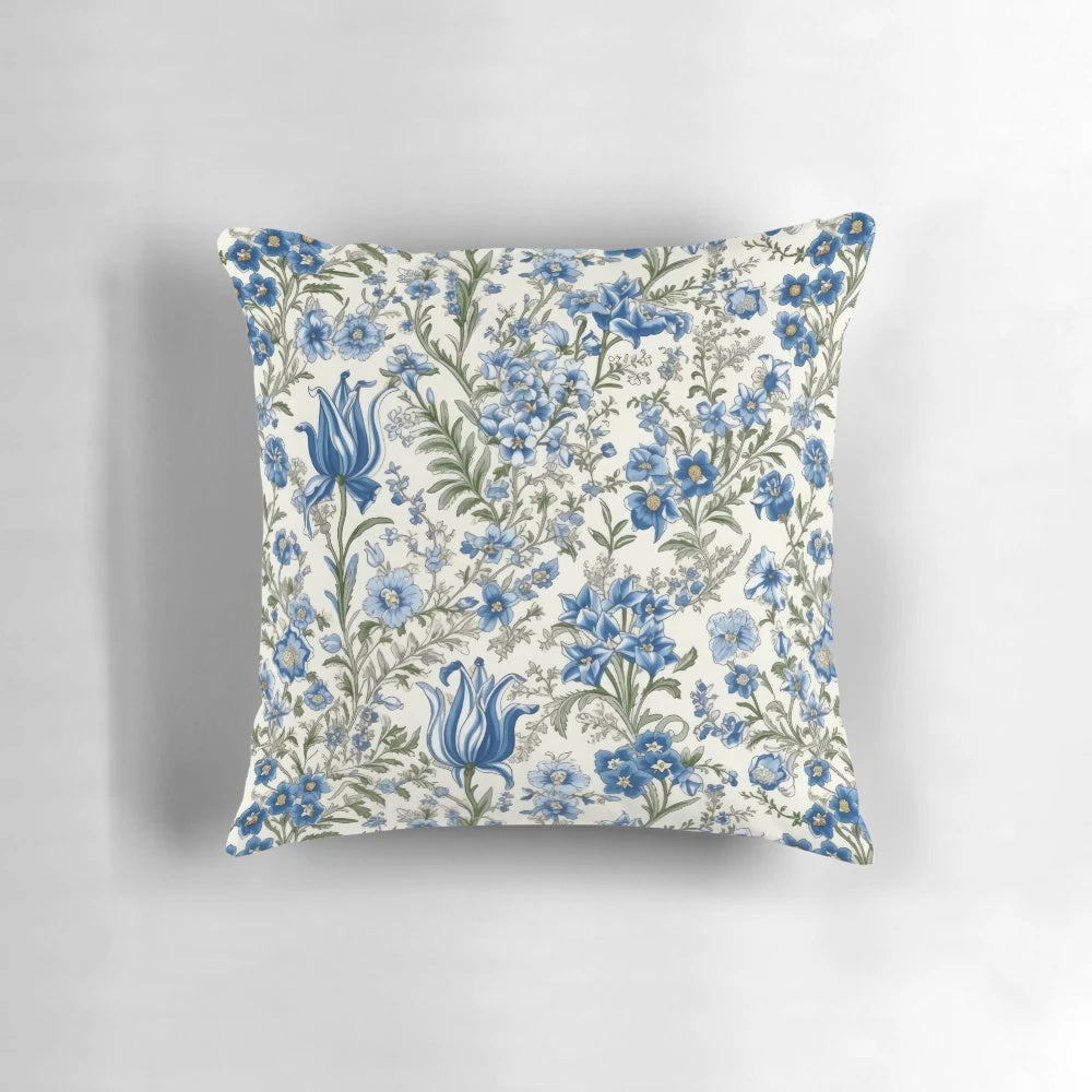 Beautiful blue floral print pillow with delicate flowers and greenery