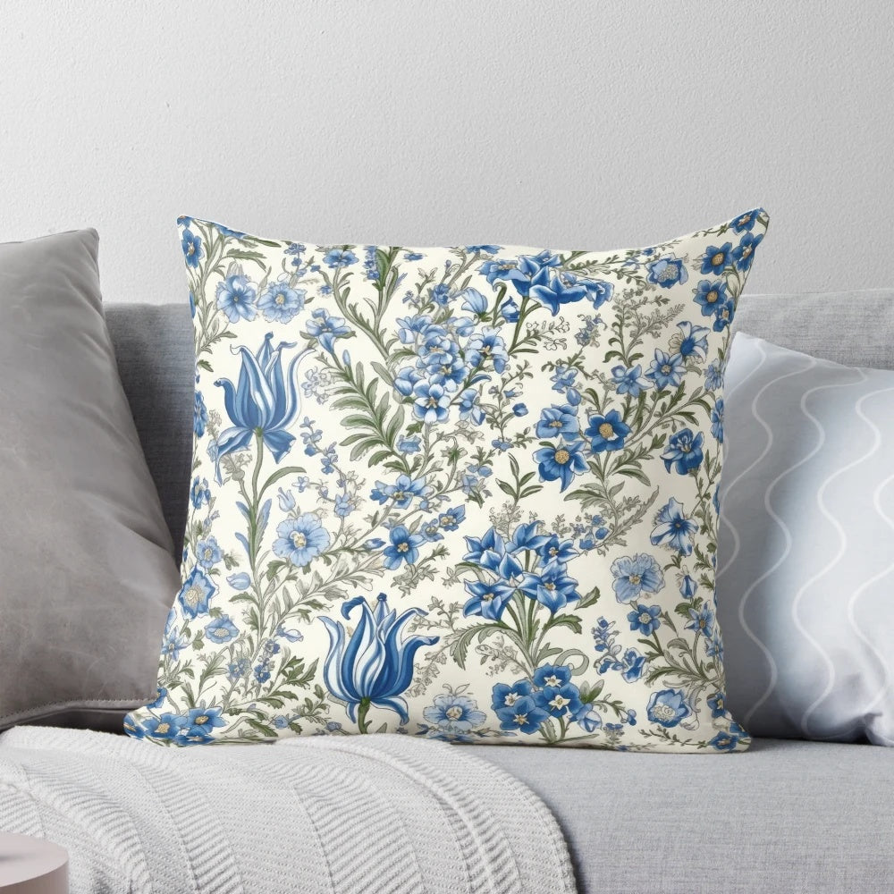 Beautiful blue floral print pillow with delicate flowers and greenery