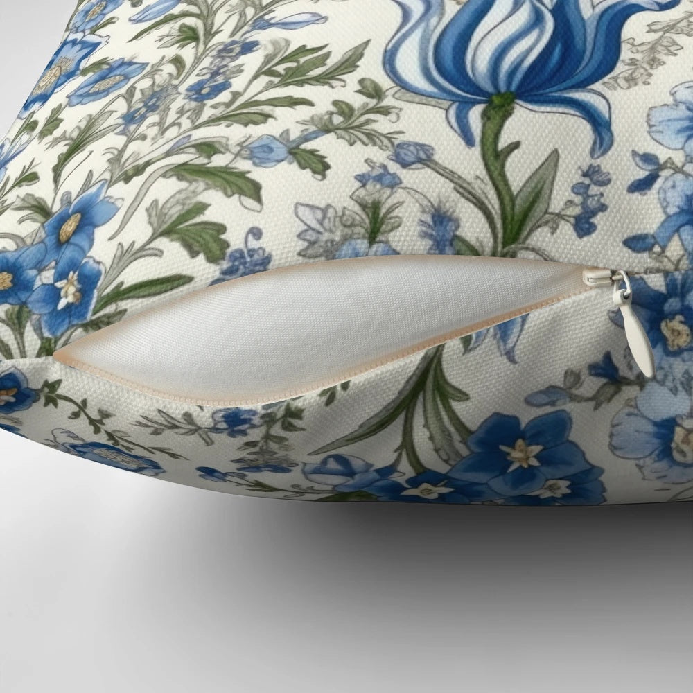 Beautiful blue floral print pillow with delicate flowers and greenery