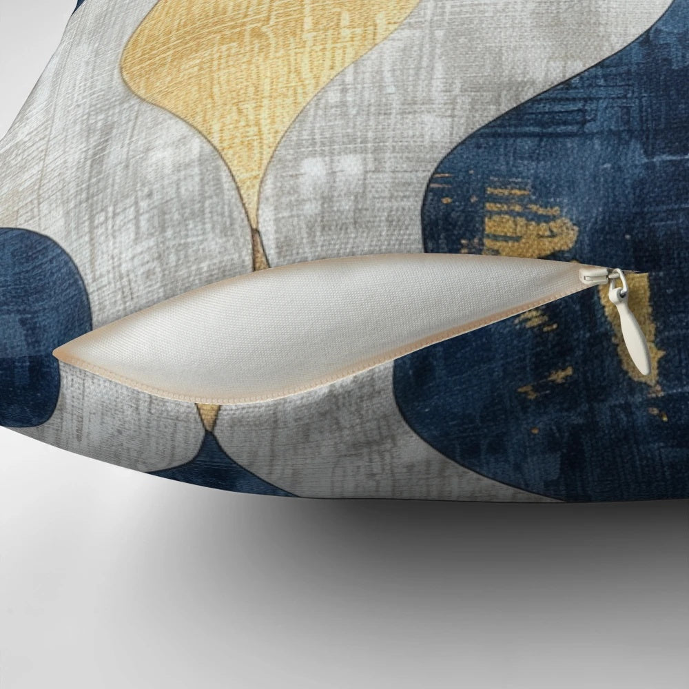 Decorative blue, gold, and white abstract patterned throw pillow