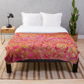 Plush bohemian-style blanket with a metallic floral pattern