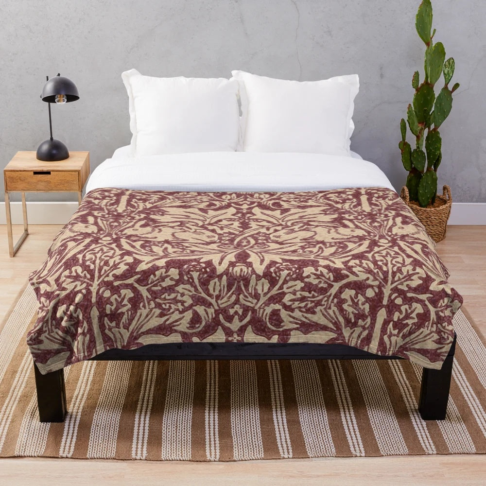 Burgundy and white Brer Rabbit patterned plush blanket inspired by the iconic British designer William Morris