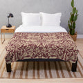 Burgundy and white Brer Rabbit patterned plush blanket inspired by the iconic British designer William Morris