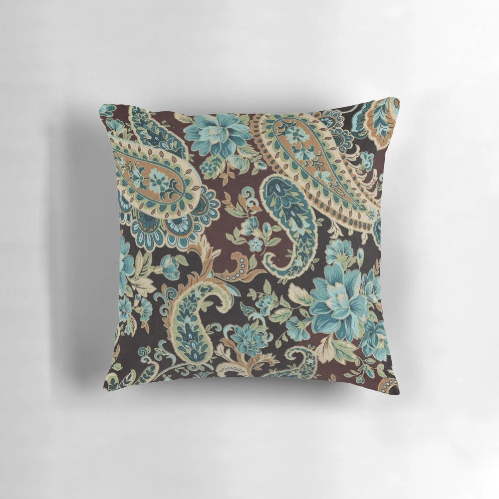 Brown and turquoise paisley patterned decorative pillow