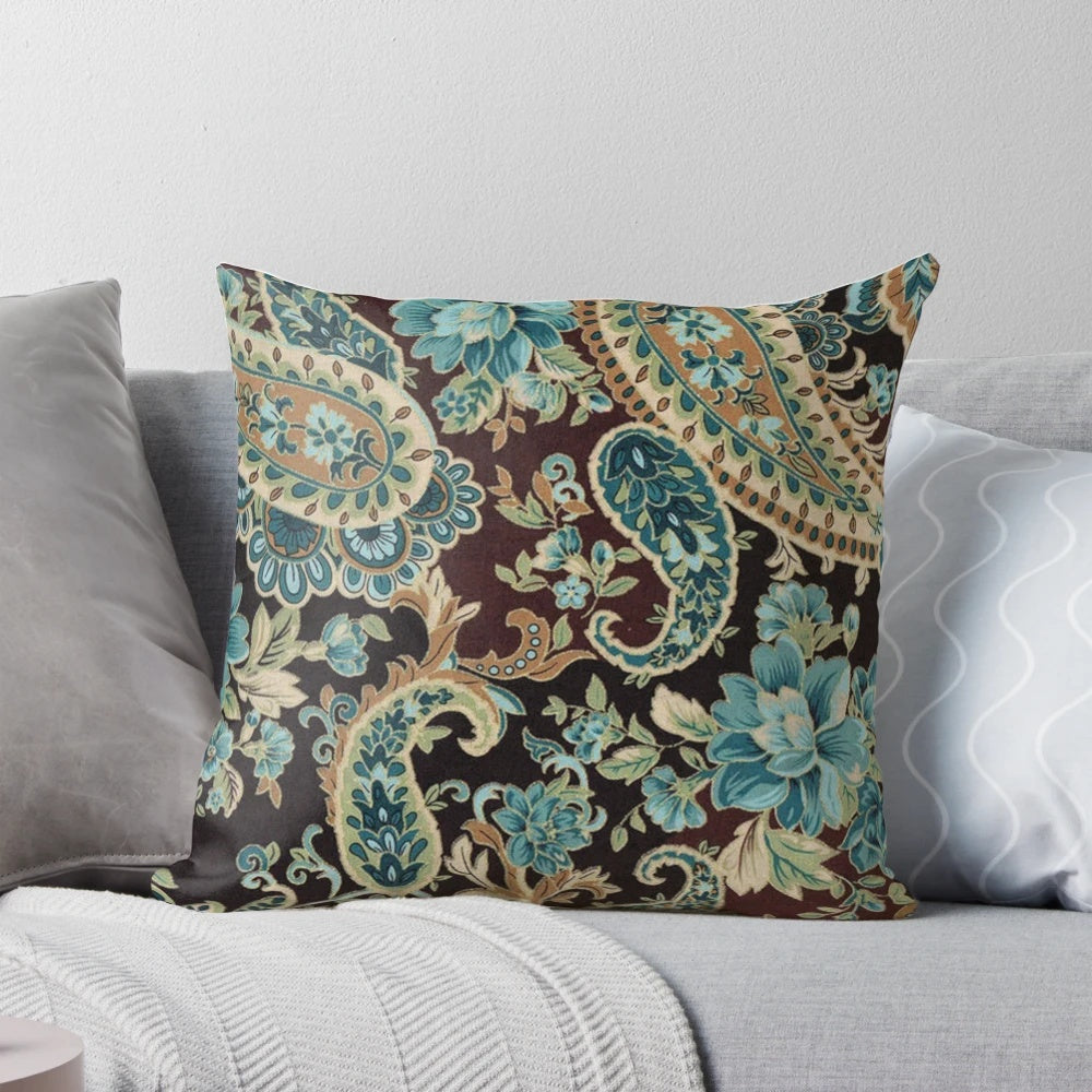 Brown and turquoise paisley patterned decorative pillow