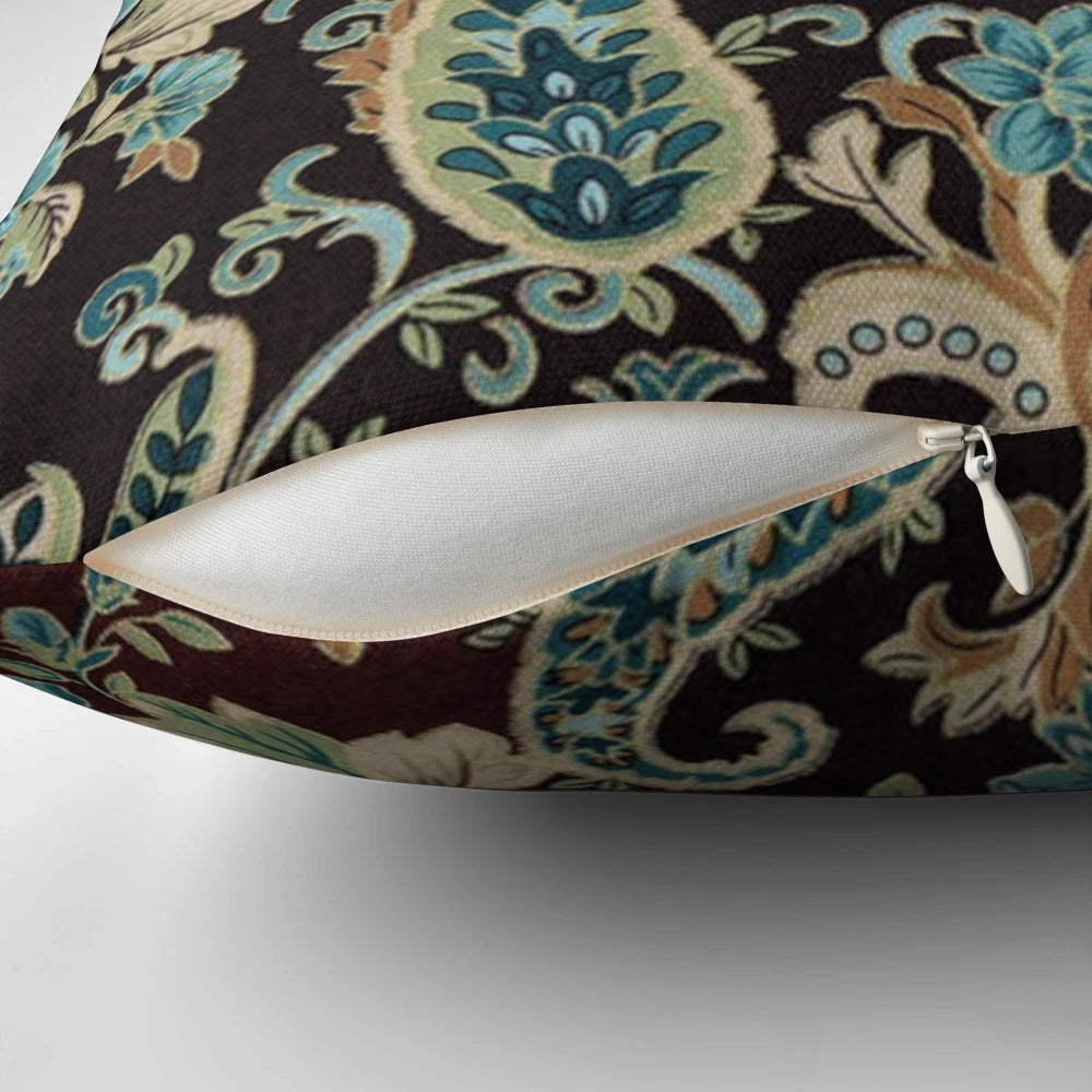 Brown and turquoise paisley patterned decorative pillow