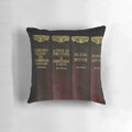 Ornate leather-bound style pillow featuring a Charles Dickens literary design