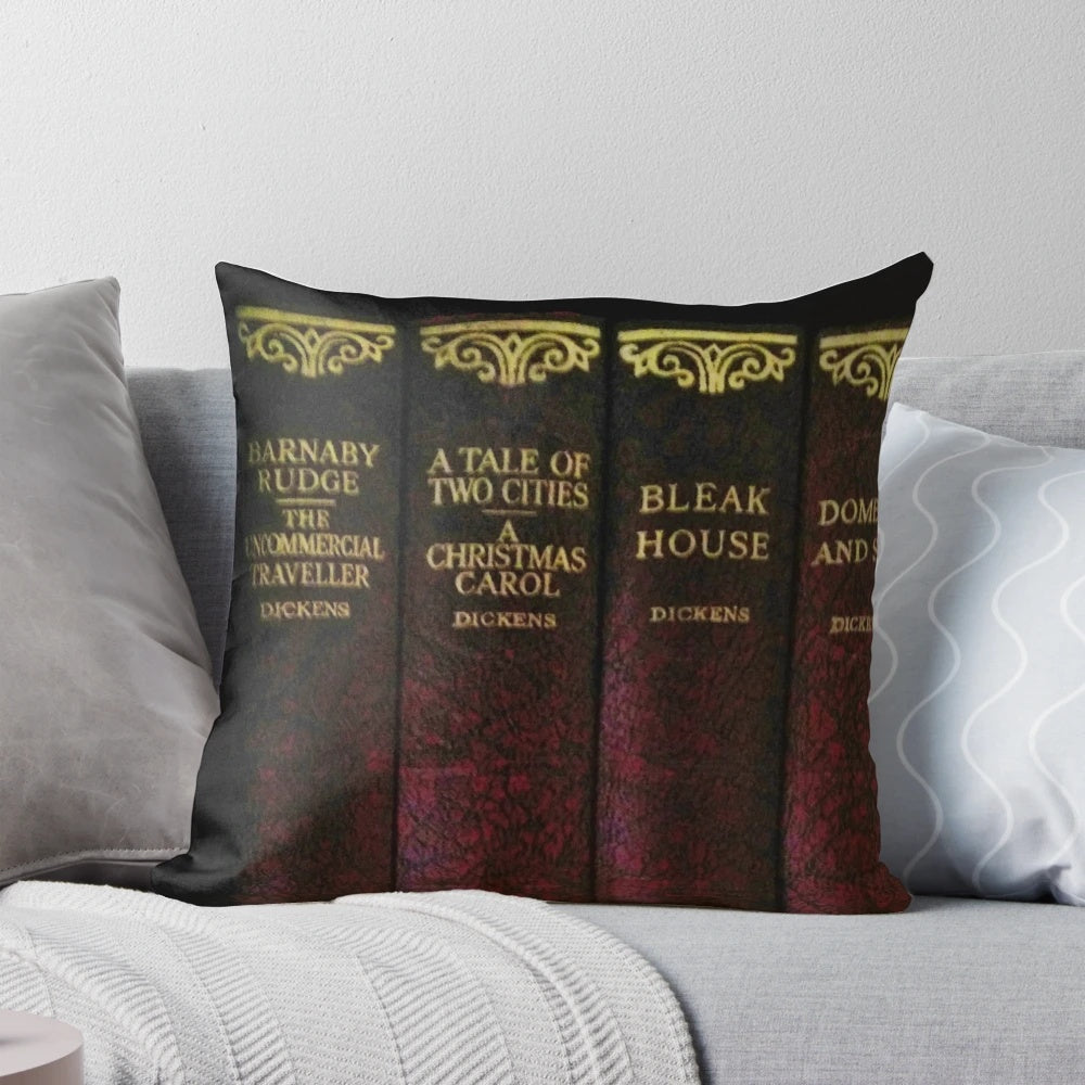 Ornate leather-bound style pillow featuring a Charles Dickens literary design