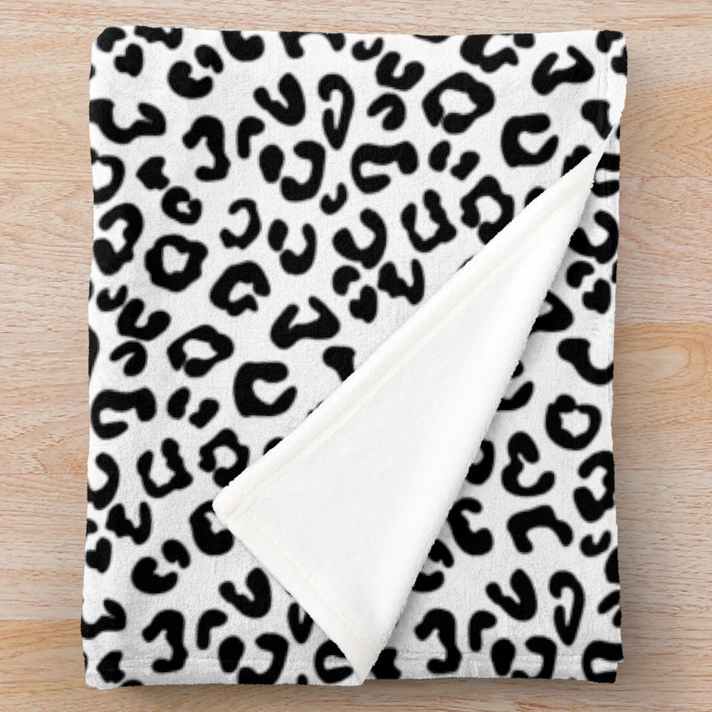 Soft and cozy cheetah print plush blanket in black and white